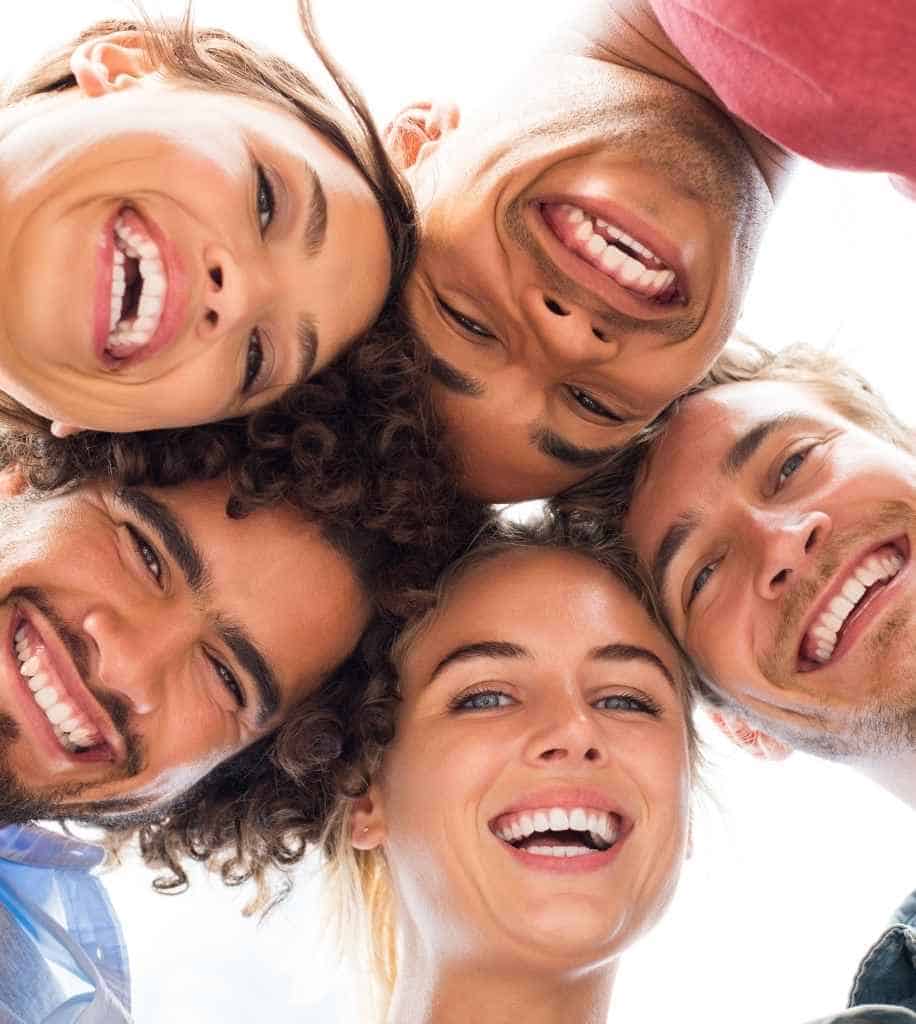 Smiling person showcasing white teeth after laser whitening treatment Swindon